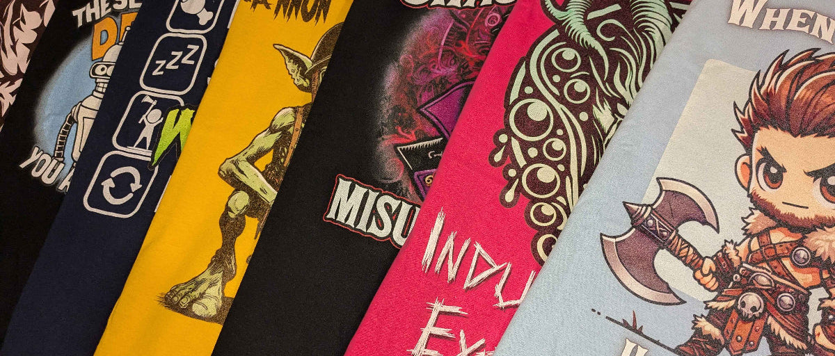 Collection of various t-shirts with different designs and text.